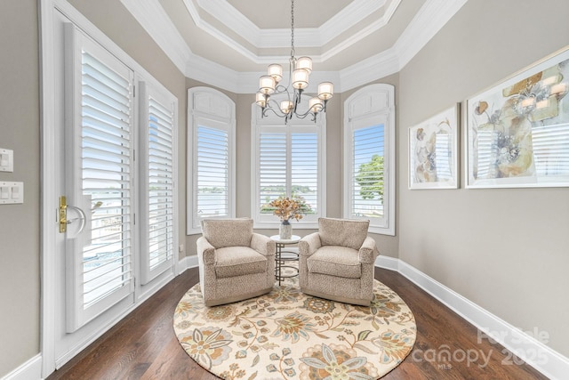3394 Governors Island Dr, Denver, NC 28037 - living area with a chandelier, ornamental molding, dark wood-style flooring, and a raised ceiling
