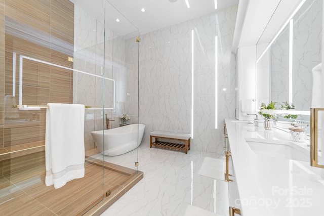 3394 Governors Island Dr, Denver, NC 28037 - full bathroom featuring tile walls, marble tiled flooring, a freestanding tub, double vanity, and a marble finish shower