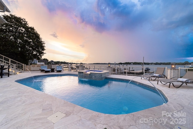 3394 Governors Island Dr, Denver, NC 28037 - pool at dusk with a pool with connected hot tub and a patio