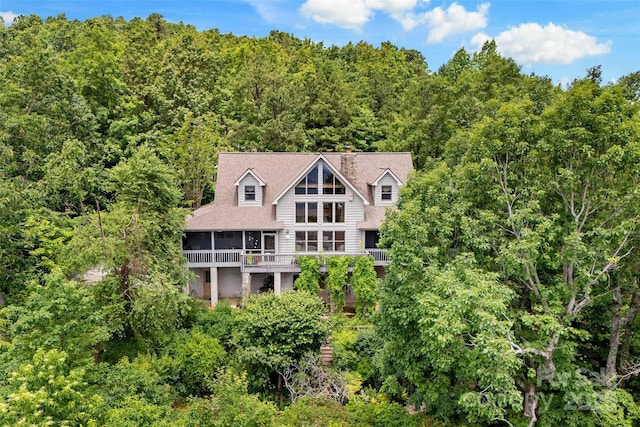 62 Skyline Dr Unit 509-510, Old Fort, NC 28762 - back of house featuring a wooded view and a sunroom