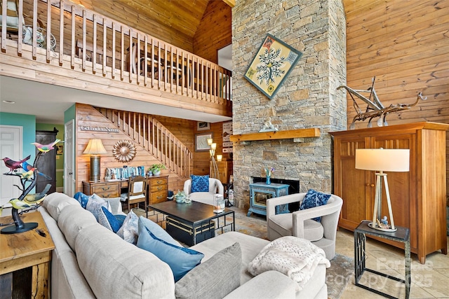 62 Skyline Dr Unit 509-510, Old Fort, NC 28762 - living area featuring high vaulted ceiling, wood walls, stairway, and a stone fireplace