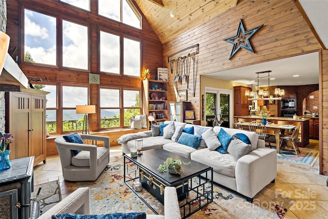 62 Skyline Dr Unit 509-510, Old Fort, NC 28762 - living area featuring high vaulted ceiling, plenty of natural light, wooden walls, light tile patterned flooring, and wooden ceiling