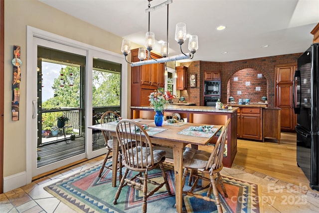 62 Skyline Dr Unit 509-510, Old Fort, NC 28762 - dining space featuring a chandelier, brick wall, and recessed lighting