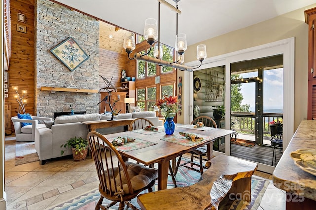 62 Skyline Dr Unit 509-510, Old Fort, NC 28762 - dining space featuring a high ceiling, a chandelier, and a stone fireplace