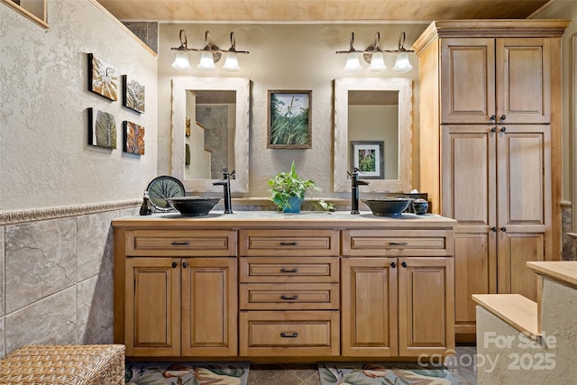 62 Skyline Dr Unit 509-510, Old Fort, NC 28762 - full bathroom featuring double vanity, a textured wall, tile walls, and wainscoting