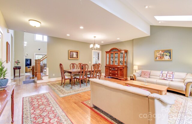 35 Village Pointe Ln, Asheville, NC 28803 - living room featuring light wood-style floors, a chandelier, recessed lighting, and a skylight