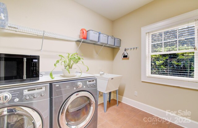 35 Village Pointe Ln, Asheville, NC 28803 - laundry area featuring washer and dryer and light tile patterned floors
