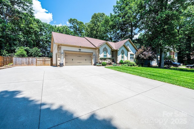 3889 Mattingly Dr, Hickory, NC 28602 - view of front facade with driveway, a garage, and stucco siding