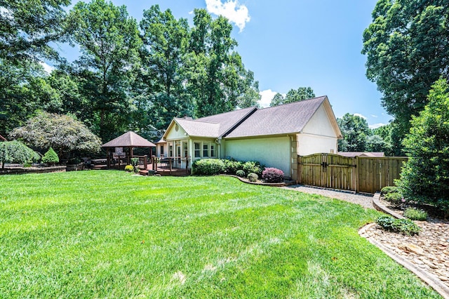 3889 Mattingly Dr, Hickory, NC 28602 - back of property featuring a gazebo, a deck, a gate, a yard, and stucco siding