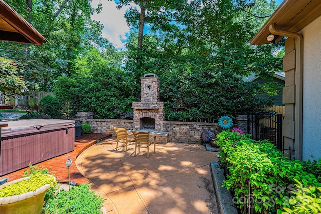 3889 Mattingly Dr, Hickory, NC 28602 - view of patio / terrace featuring an outdoor stone fireplace and a hot tub