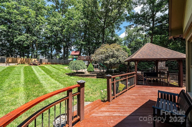 3889 Mattingly Dr, Hickory, NC 28602 - wooden deck featuring a gazebo, a playground, and a fenced backyard