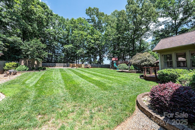 3889 Mattingly Dr, Hickory, NC 28602 - fenced backyard with a playground and a storage shed