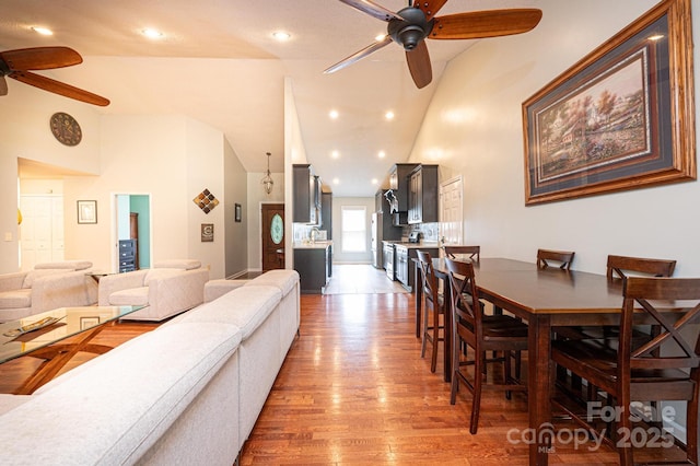 3889 Mattingly Dr, Hickory, NC 28602 - dining room featuring a ceiling fan, wood finished floors, high vaulted ceiling, and recessed lighting