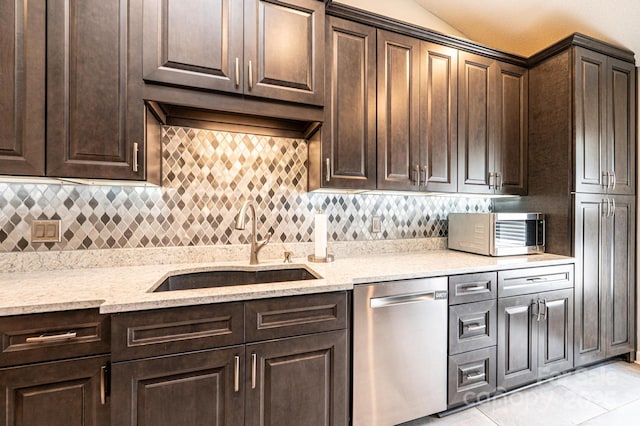 3889 Mattingly Dr, Hickory, NC 28602 - kitchen with appliances with stainless steel finishes, dark brown cabinets, backsplash, light tile patterned floors, and light stone countertops