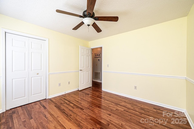 3889 Mattingly Dr, Hickory, NC 28602 - unfurnished bedroom featuring wood finished floors, a closet, and a ceiling fan