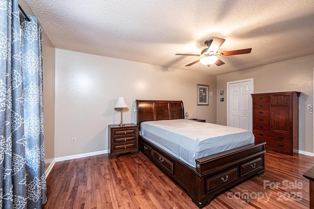 3889 Mattingly Dr, Hickory, NC 28602 - bedroom featuring dark wood-style flooring, ceiling fan, and a textured ceiling