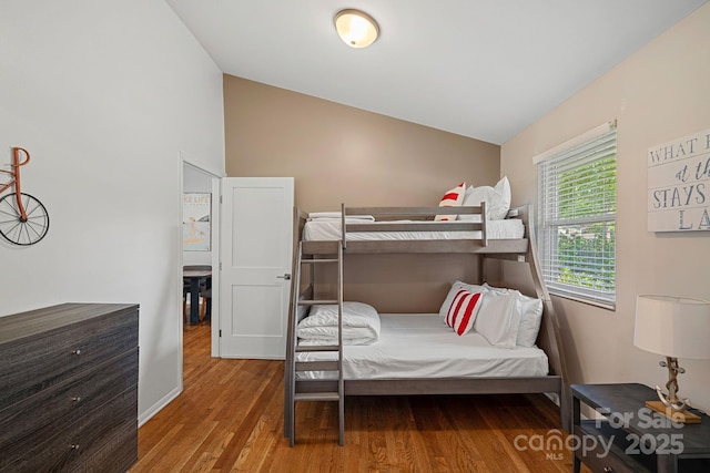 21212 Rio Oro Dr, Cornelius, NC 28031 - bedroom with vaulted ceiling and wood finished floors