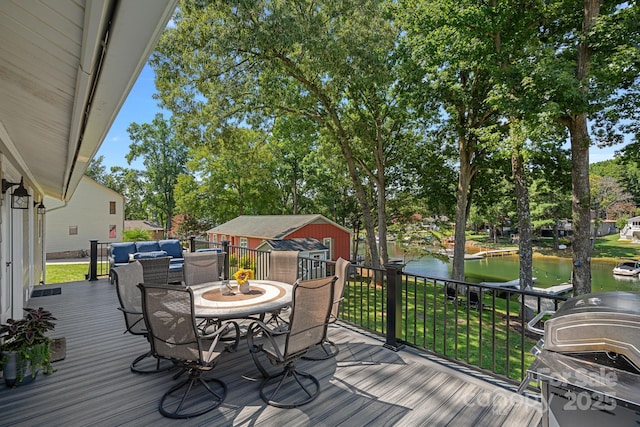 21212 Rio Oro Dr, Cornelius, NC 28031 - deck with a water view, a grill, a lawn, outdoor dining area, and view of wooded area