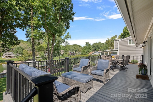 21212 Rio Oro Dr, Cornelius, NC 28031 - deck with outdoor dining space and view of wooded area
