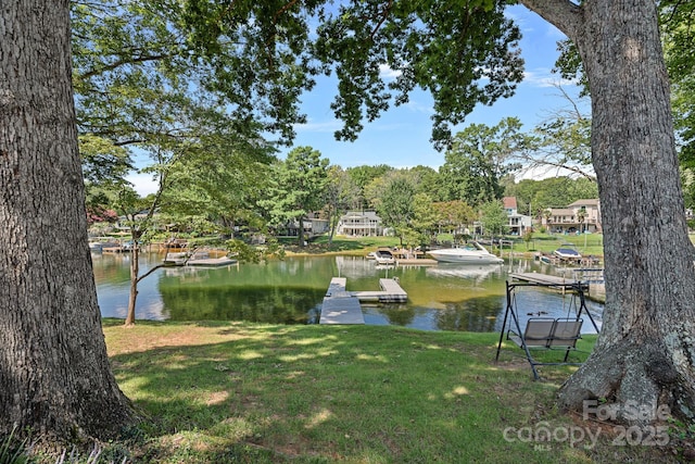 21212 Rio Oro Dr, Cornelius, NC 28031 - view of green lawn with a floating dock and a water view