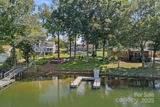 21212 Rio Oro Dr, Cornelius, NC 28031 - dock featuring a water view and a lawn