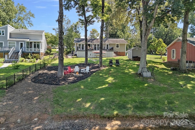 21212 Rio Oro Dr, Cornelius, NC 28031 - view of yard featuring a deck, a shed, stairway, and a sunroom