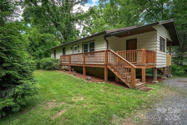 24 Arco Rd, Asheville, NC 28805 - view of front of house with a front lawn, a deck, and stairs