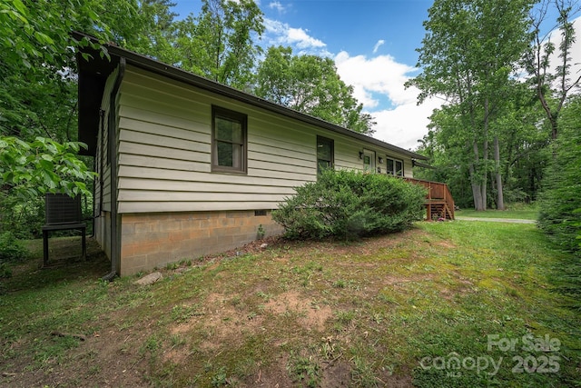 24 Arco Rd, Asheville, NC 28805 - view of home's exterior featuring crawl space, a yard, a deck, and stairs