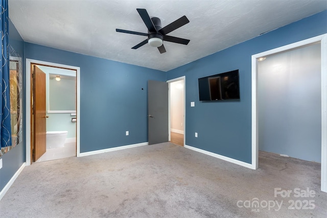 24 Arco Rd, Asheville, NC 28805 - unfurnished bedroom with carpet flooring, connected bathroom, and ceiling fan