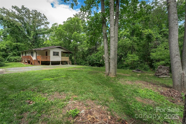 24 Arco Rd, Asheville, NC 28805 - view of grassy yard with a porch