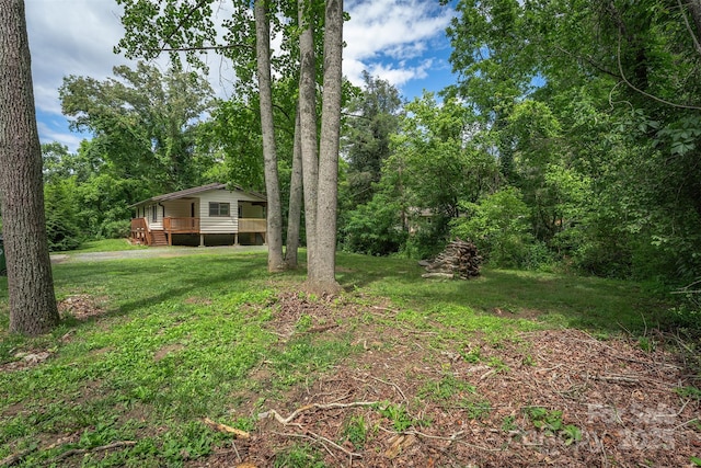 24 Arco Rd, Asheville, NC 28805 - view of green lawn with a deck