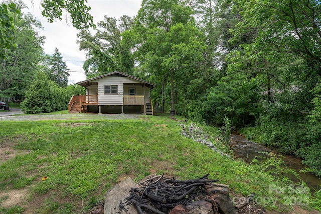 24 Arco Rd, Asheville, NC 28805 - rear view of property with a porch, stairs, a yard, and an outdoor fire pit