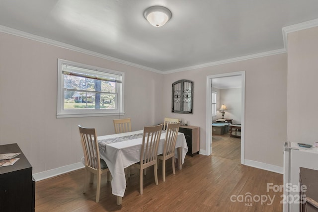 2008 Kimway Dr, Matthews, NC 28105 - dining area featuring wood finished floors and crown molding