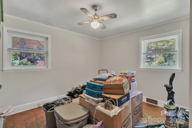 2008 Kimway Dr, Matthews, NC 28105 - miscellaneous room featuring wood finished floors, ornamental molding, and a ceiling fan