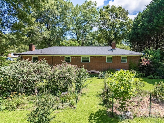 2008 Kimway Dr, Matthews, NC 28105 - rear view of house featuring a chimney, a yard, and brick siding