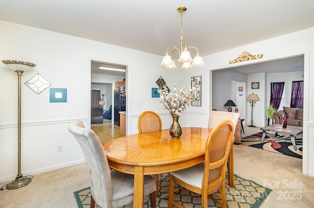 6619 Bittinger Ct, Charlotte, NC 28216 - dining area featuring light colored carpet and a chandelier