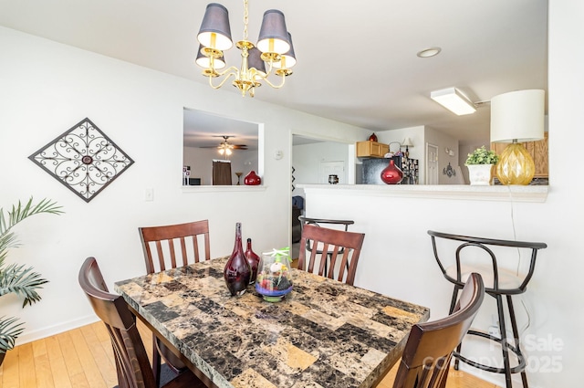 6619 Bittinger Ct, Charlotte, NC 28216 - dining area with wood finished floors, a chandelier, and recessed lighting