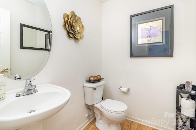 6619 Bittinger Ct, Charlotte, NC 28216 - half bath with a sink and wood finished floors