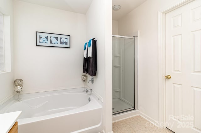 6619 Bittinger Ct, Charlotte, NC 28216 - full bath featuring a shower stall, a garden tub, and vanity