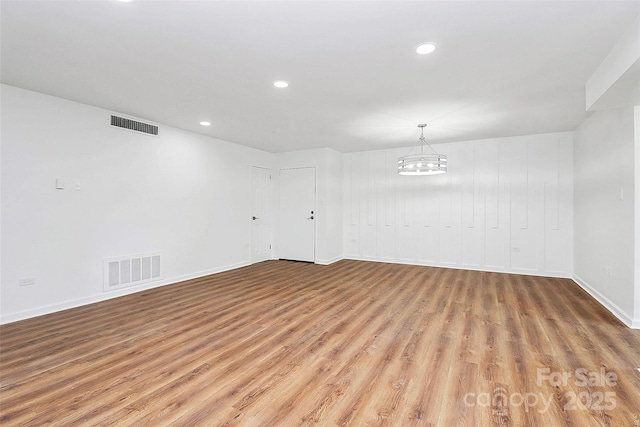 1300 Queens Rd Unit 405, Charlotte, NC 28207 - empty room with wood finished floors, recessed lighting, and a chandelier