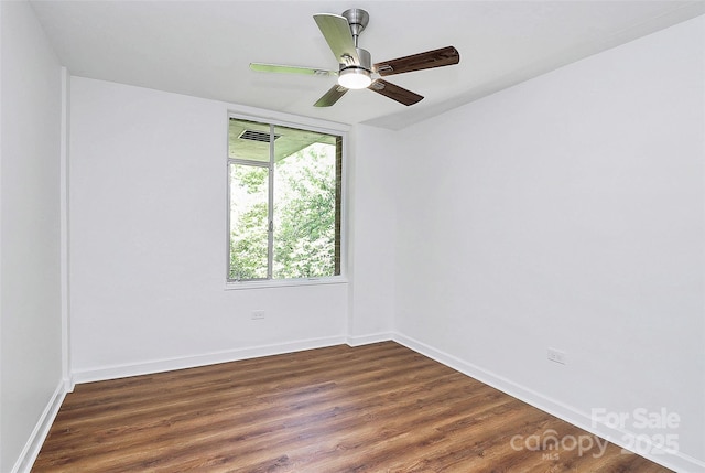 1300 Queens Rd Unit 405, Charlotte, NC 28207 - spare room featuring dark wood-style flooring and a ceiling fan