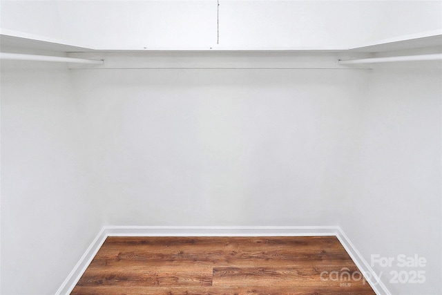 1300 Queens Rd Unit 405, Charlotte, NC 28207 - walk in closet featuring dark wood-style flooring