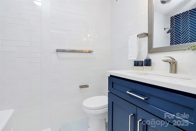 1300 Queens Rd Unit 405, Charlotte, NC 28207 - bathroom with tile walls, vanity, and marble finish flooring