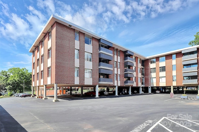 1300 Queens Rd Unit 405, Charlotte, NC 28207 - view of apartment building / complex with covered and uncovered parking