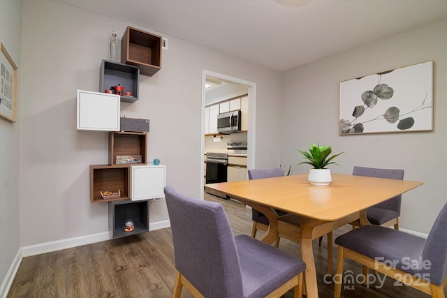 825 21st Ave NE, Hickory, NC 28601 - dining area featuring wood finished floors and baseboards