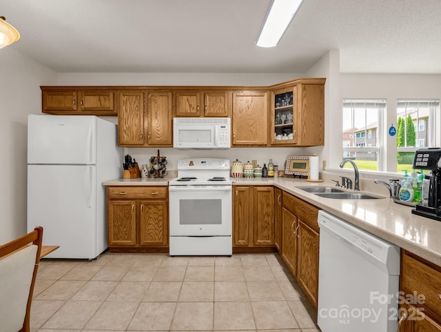 1901 Deermouse Way, Hendersonville, NC 28792 - kitchen with white appliances, brown cabinetry, light countertops, and glass insert cabinets