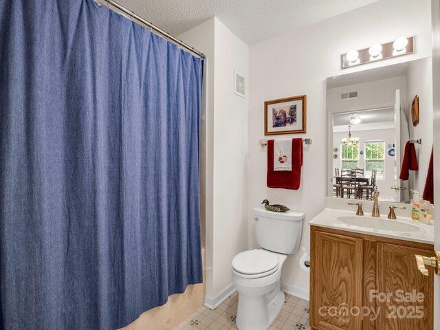 1901 Deermouse Way, Hendersonville, NC 28792 - bathroom featuring vanity, a textured ceiling, a chandelier, tile patterned floors, and shower / bath combination with curtain