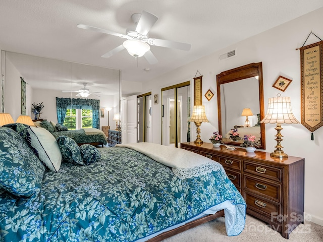 1901 Deermouse Way, Hendersonville, NC 28792 - bedroom featuring two closets, light carpet, and ceiling fan