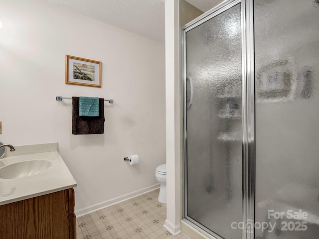 1901 Deermouse Way, Hendersonville, NC 28792 - bathroom featuring vanity, a shower stall, tile patterned floors, and a textured ceiling