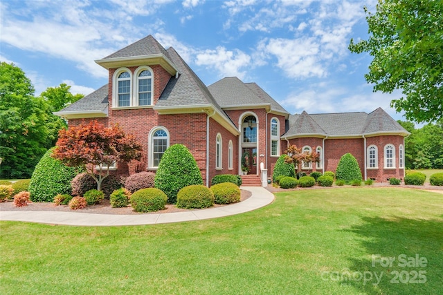 572 W Shiloh Unity Rd, Lancaster, SC 29720 - view of front facade with brick siding, a front lawn, and roof with shingles